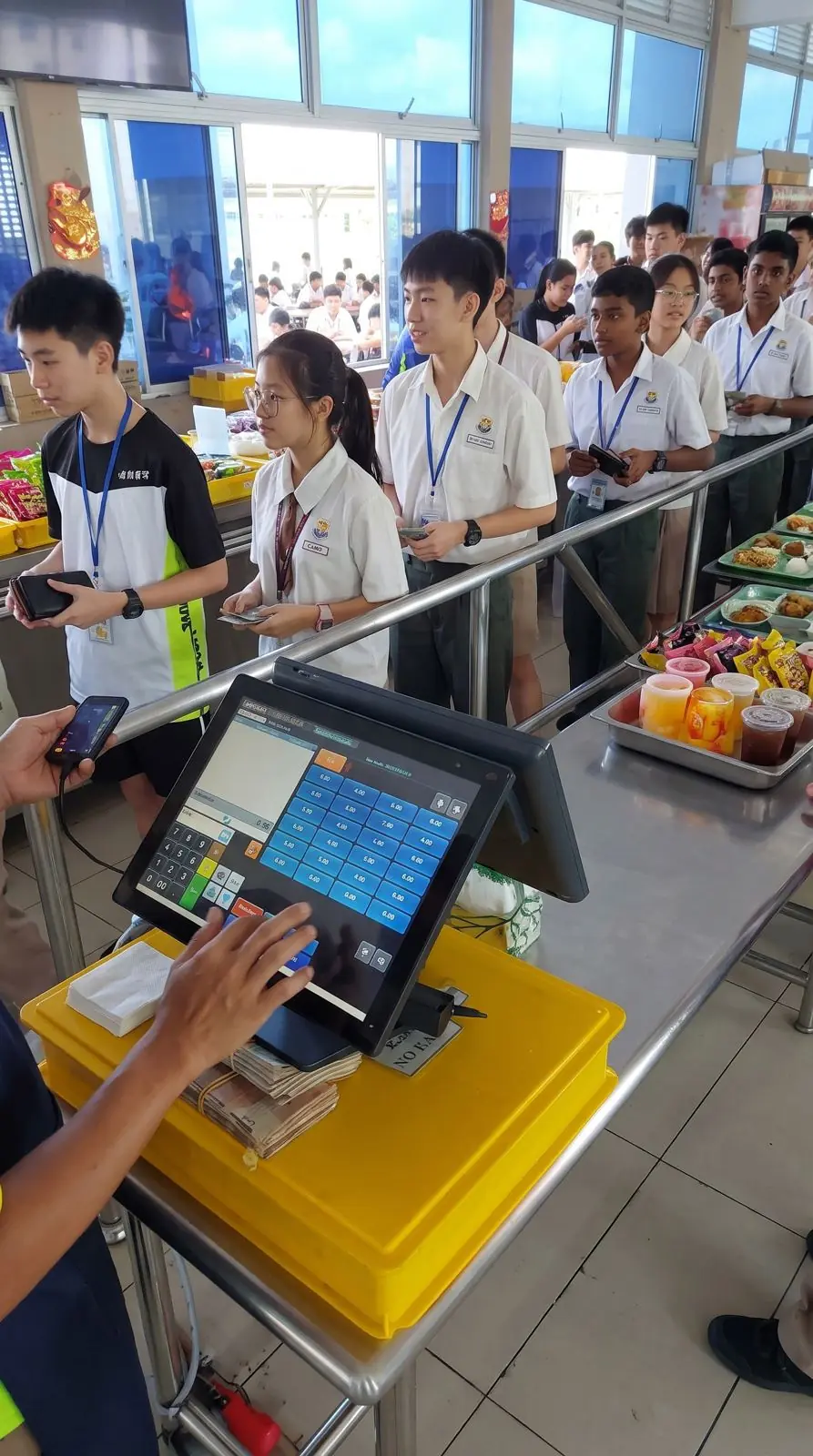 Long queue of secondary students at the school canteen counter